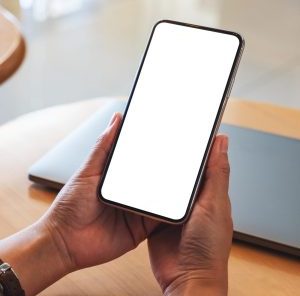 Mockup,Image,Of,A,Woman,Holding,Mobile,Phone,With,Blank